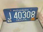 Michigan Trailer License Plate # J 40308 Expired Over Years Blue & White. Fixed Price $9.23.