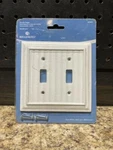 Liberty Hardware Brainerd Pure White Double Toggle Switch Plate Beadboard 297659. Fixed Price $10.00.
