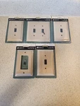 3 Single Liberty Wall Plates, 1 Double Switch, Outlet New. Fixed Price $26.97.