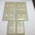 LOT/6 Vintage Bakelite Ribbed Ivory Mcdonald Sierra Line Toggle Covers. Fixed Price $22.00.
